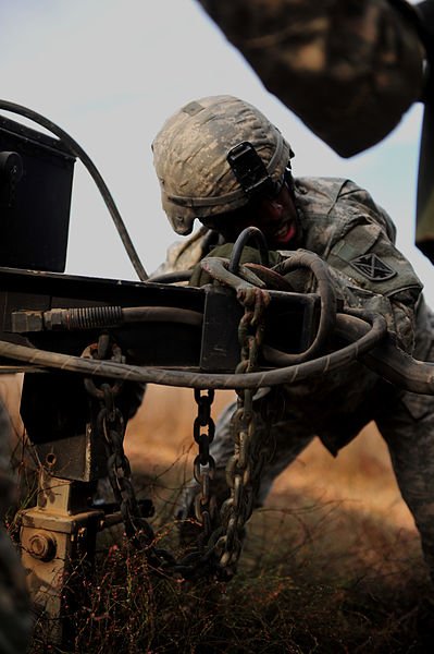 File:A U.S. Soldier with the 5th Battalion, 7th Air Defense Artillery Regiment extends a support leg on a trailer-mounted generator during testing of Patriot missile communications as part of Austere Challenge 2012 121024-F-QW942-084.jpg