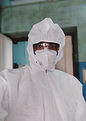 A doctor wearing PPE to prevent exposure to COVID-19 A doctor wearing personal protective equipment for treating patients with COVID-19.jpg