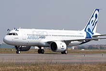 Celebrating the 25 September 2014 first flight with flags from the cockpit Airbus A320neo landing after first flight.jpg