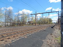 The Ampere station site in April 2015 with the abandoned platforms Ampere Station - April 2015.jpg