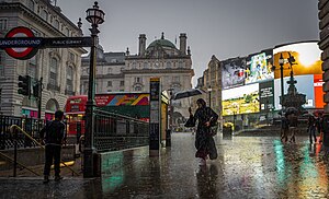An intense but brief rain storm at Piccadilly Circus during the late afternoon on 26 August 2023.jpg