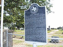 A Texas Historical Commission marker outside the Aurora Cemetery, alleged burial site of the UFO pilot, which briefly mentions the incident. Aurora cemetery plaque.jpg