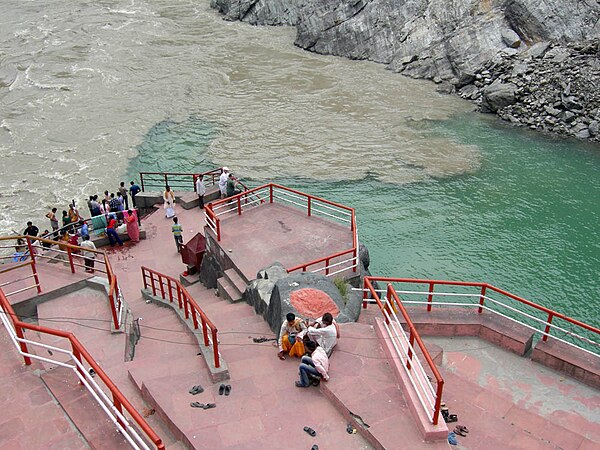 The same confluence viewed from upstream at a different time; note the swirl of sediment from the Alaknanda.