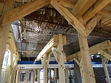 Wooden bracing under the closed footbridge in 2022 Bracing for footbridge at Suffolk Downs station, March 2022.JPG