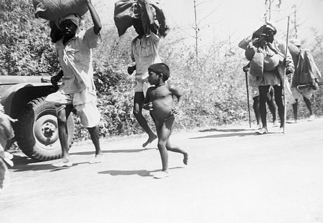 Indian refugees flee Burma along the Prome Road from Rangoon to Mandalay and eventually on to India, January 1942.