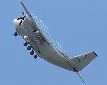 C-27J performing at the Paris Air Show with Prop vortices condensation visible.