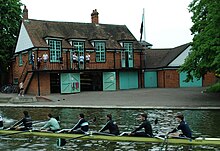 Caius M1 outside their boathouse during Mays 2012. Caius Boat Club.jpg