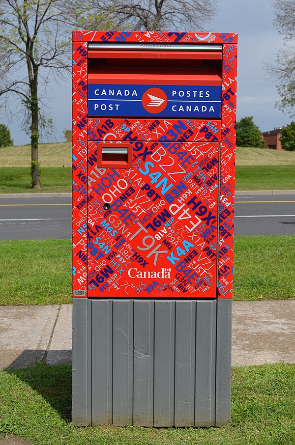 New kaleidoscope pattern (designed to deter graffiti) mailbox with the Canada Post brand.