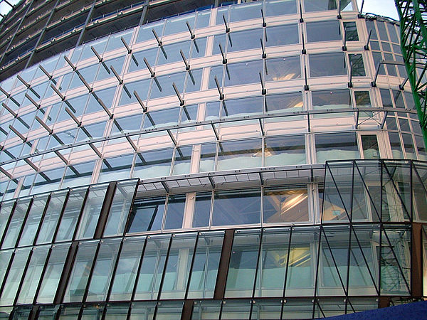A Waagner-Biro double-skin facade being assembled at One Angel Square, Manchester. The brown outer facade can be seen being assembled to the inner whi