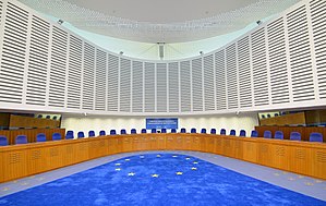 The European Court of Human Rights in Strasbourg, Europe's highest human rights authority, uses the Flag of Europe but is not part of the EU. All EU member states are in the European Convention, and the EU treaties require it to join, but the Court of Justice has delayed. Courtroom European Court of Human Rights 04.JPG