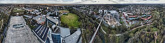 Aerial perspective of Gardiners Creek and trail cutting across the Deakin University Burwood campus. Shot September 2018. Altitutude: 110m. Deakin University Burwood Campus Aerial Panorama.jpg