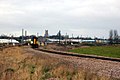 A Class 153 operated by Abellio Greater Anglia leaving Ely Dock Junction on a service to Ipswich with the ex-GER mainline in the background and Ely Cathedral on the skyline