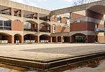 Falmer House Including Moat Within Courtyard Falmer House inner courtyard showing arches, building levels and divisions and part of inner moat, University of Sussex.jpg