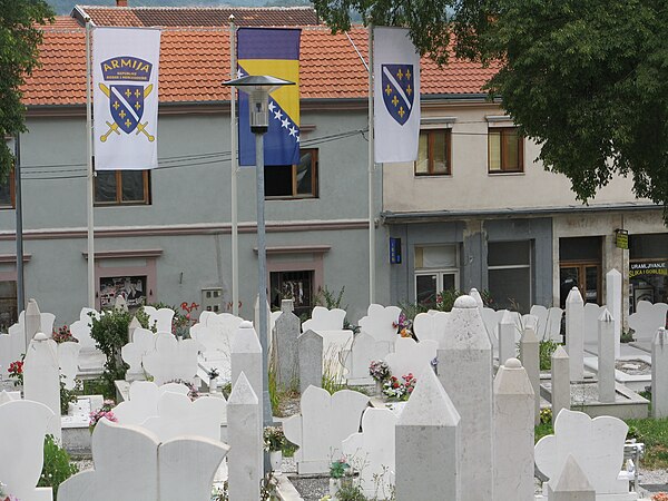 A cemetery in Mostar flying the flag of Army of the Republic of Bosnia and Herzegovina (left), the flag of Bosnia and Herzegovina, and the flag of the