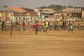 Football Players on Soil Field