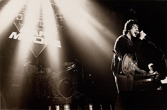 Moore performing at the Manchester Apollo in 1983.