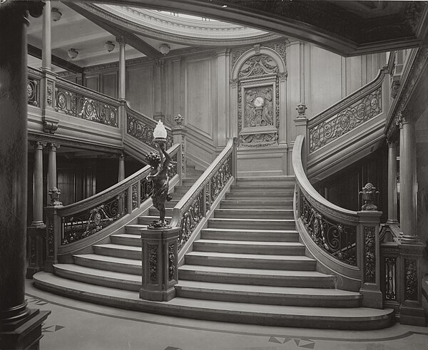 The Grand Staircase of the Olympic with the famous clock, thought to be identical to the one on Titanic