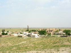 View of a portion of the old town with the Harran Castle in the background