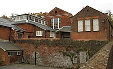 The school buildings of 1853 (left), 1837 (centre) and 1904 (right). Hitchinschoolsnew.jpg