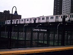 A New Lots Avenue-bound 3 train of R62s passing above Livonia Avenue after leaving Junius Street. IRT Eastern Parkway Branch.jpg
