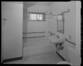 Interior view of ground floor unit at west end of Building No. 23, looking from hallway into bathroom. Looking northwest - Easter Hill Village, Building No. 23, North side of South HABS CA-2783-P-11.tif
