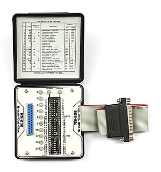 Example of a pocket-sized RS-232 breakout box that features switches to reconfigure or patch any or all the active circuitry. This unit has one DB25 male and one DB25 female RS-232 connector KL Break Out Box RS-232.jpg