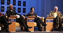 Michelle Guthrie (centre) speaking at the World Economic Forum Annual Meeting Davos 2007. Klaus Schwab, Michelle Guthrie, E. Neville Isdell on the World Economic Forum Annual Meeting Davos 2007 (374703484).jpg