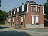 Eenheidsbebouwing van bureel en conciërgewoning