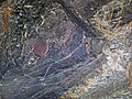 Magnetite-rich banded iron-formation (BIF) (Michipicoten Iron-Formation, Neoarchean, 2696-2749 Ma; Route 17 roadcut east of Bridget Lake, south of Wawa, Ontario, Canada) 4 (48268682486).jpg