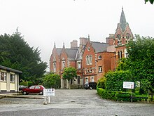 Mount Temple Comprehensive School where Larry Mullen Jr. posted a notice looking for musicians to form a band. MountTempleClock.jpg