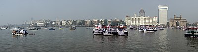 Gateway of India. Taj Mahal Hotel and Mumbai skyline from Elephanta Island ferry