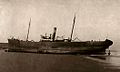 1908 photo of SS Nellie Wise aground on beach