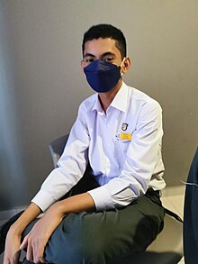 Ong Kai Jin sitting in school library