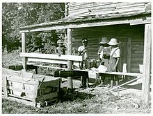 Pauline Clyburn, rehabilitation client, and her children stringing tobacco, photographed by Marion Post Wolcott (June 1939) Pauline Clyburn, rehabilitation client, and her children str... (3110573452).jpg