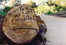 Unofficial memorial: 25 years of People's Park. "Remove parking lot, put in a paradise" is an allusion to Joni Mitchell's song "Big Yellow Taxi". People's Park 25 years.jpg