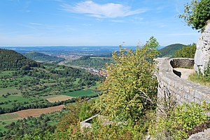 View from Reußenstein to the nature reserve on the left at the lower edge of the forest with juniper heather towards Neidlingen.  In the background the Limburg castle ruins