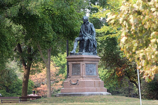 A bronze statue of the famous Scottish poet Robert Burns sculpted by Charles Calverley in 1888. This structure is located in the Washington Park neigh