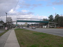 The Rommel Avenue Catwalk is used by the school kids of George A. Mercer Middle School and other pedestrians to safely cross Augusta Road (State Highway 21). Rommel Ave Catwalk.JPG