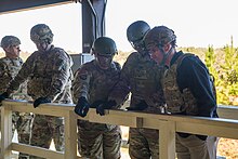 Dr. Mark Esper visits Fort Benning, GA in November 2018, where he conducted ACFT drills with student officers, visited the 75th Ranger Regiment, and watched new soldiers in the recently lengthened Infantry OSUT course conduct live fire urban warfare training. (U.S. Army photo by Staff Sgt. Nicole Mejia) Secretary Esper visits Fort Benning, GA.jpg