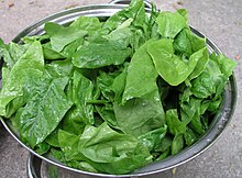 Spinach leaves in a colander Spinach leaves.jpg