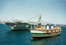 Newly rebuilt as North Head and alongside HMAS Vengeance as part of Queen Elizabeth II's first visit to Australia, 1954 Sydney ferry NORTH HEAD alongside HMAS VENGEANCE 3 March 1954.png