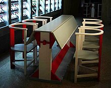 A table section with a folding tabletop, and a set of chairs. 2021 reconstruction Table from the Workers Club.jpg