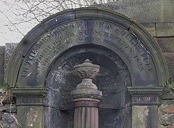 The inscription on the pediment above the 1825 Soulis Cross. The Soulis Cross inscription, Old High Kirk, Kilmarnock, Ayrshire.jpg