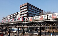 Two trains about to pass on an elevated railway in Hamburg