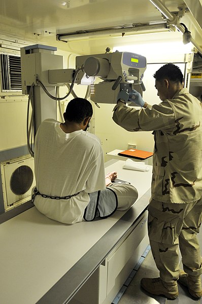 File:US Navy 101028-N-3887D-029 Petty Officer 2nd Class Jae Yun prepares to take an x-ray of a detainee's foot at the detainee hospital.jpg