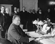 President William Howard Taft at his desk in the Oval Office, signing the statehood bill for New Mexico on January 6, 1912. William Howard Taft - Signing the New Mexico Statehood Bill - LCCN2016861539.jpg