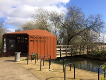 Woodberry Wetlands entrance with bridge over New River