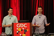 Technical designer Mark Wilson and narrative designer Kaelin Lavallee during their presentation about the game's story and systems at GDC 2015 Worlds Collide- Combining Story and Systems in Dragon Age- Inquisition (16713806236).jpg