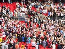 Hull Kingston Rovers players and staff climb back down from the Royal Balcony after receiving their runners-up awards at the 2023 Challenge Cup Final.