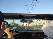 View of wholesale buildings on both sides of 6th Street as automobile heads toward the new 6th Street bridge, July 2022. 6th Street Los Angeles, heading toward the 6th Street Bridge.jpg